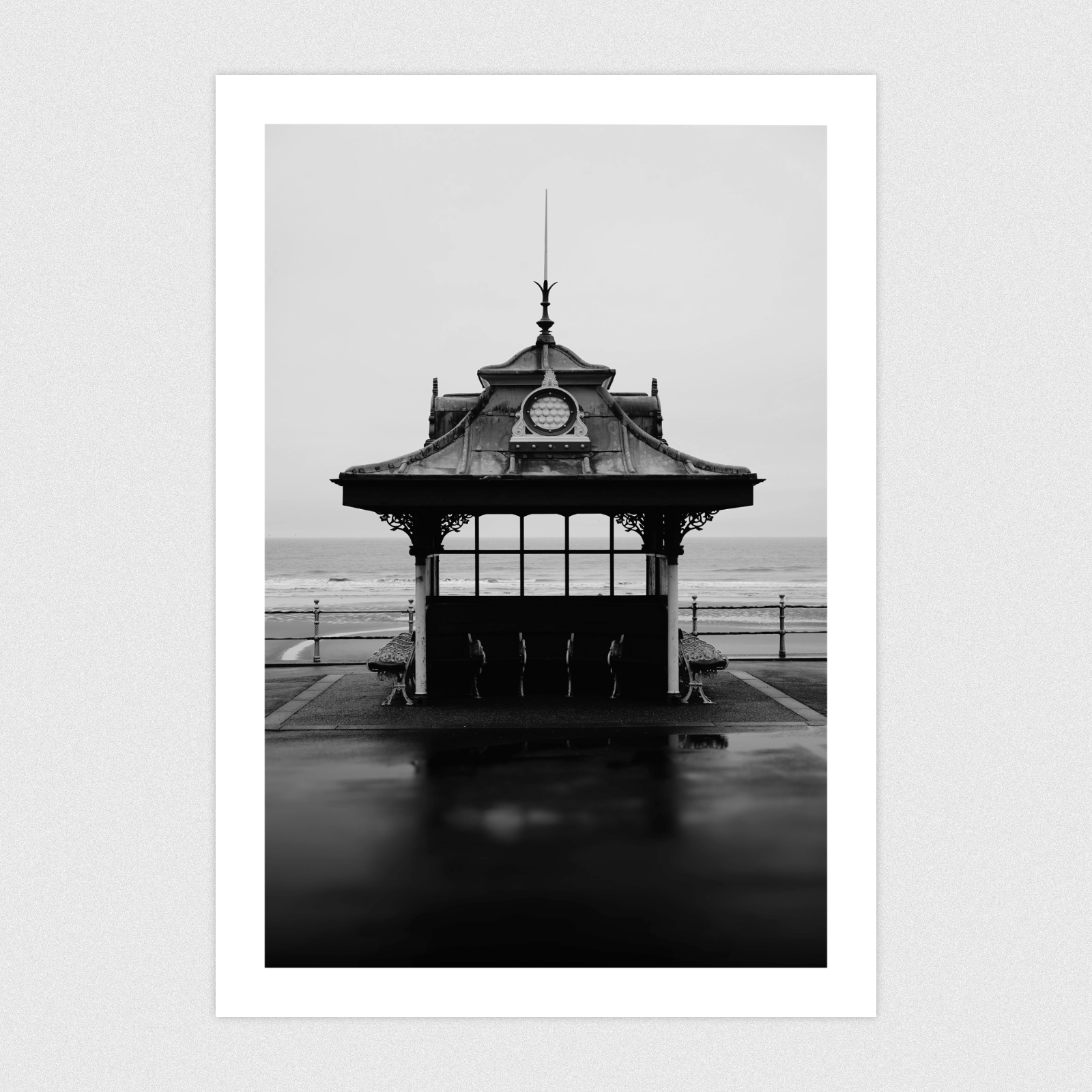 Black and white photo of an old vivtorian seaside shelter.