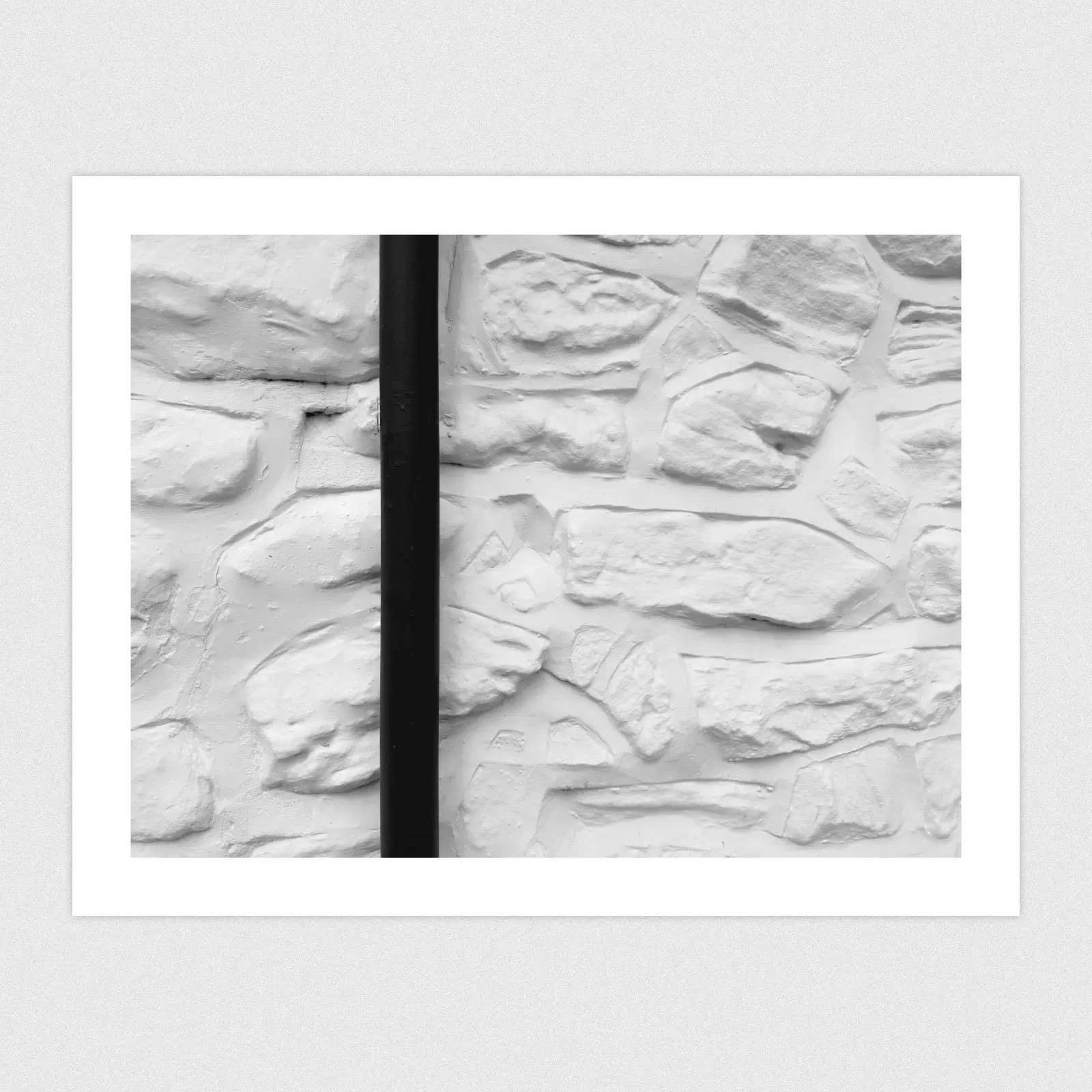 Portfolio A beautiful old textured white wall and a drainpipe.