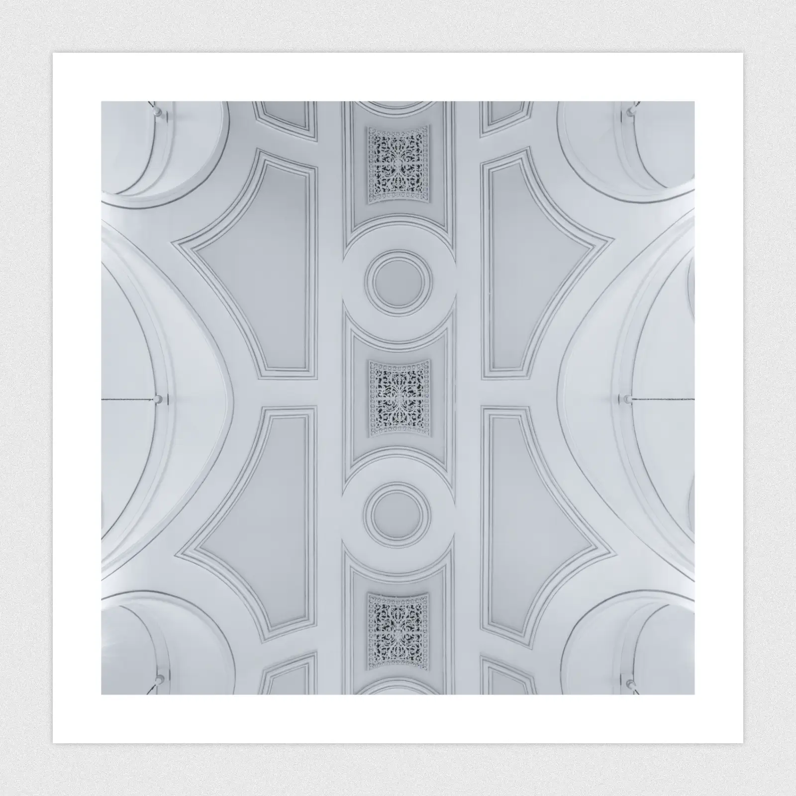 Looking straight up at an ornate cathedral ceiling.