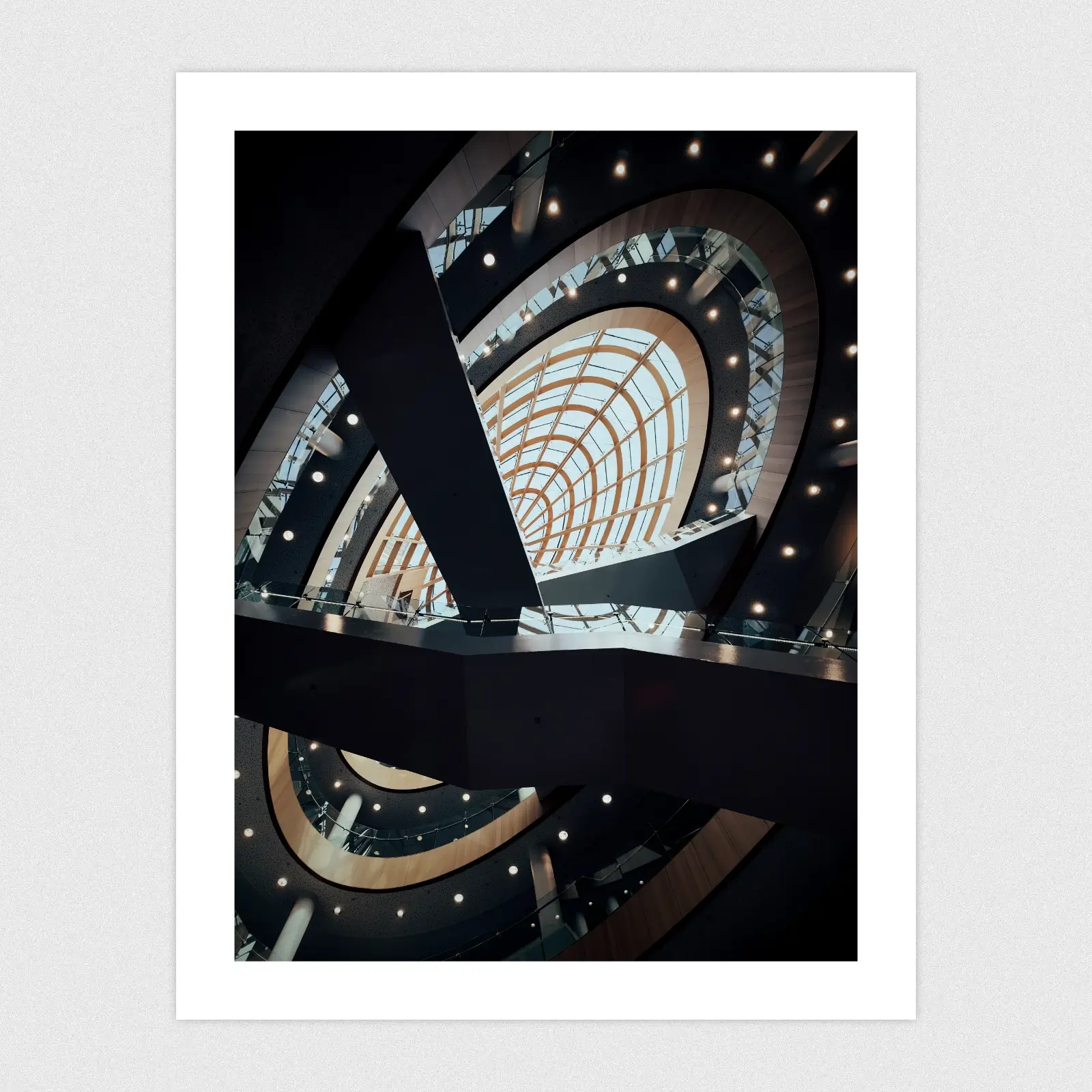 A dark edit of the inside of Liverpool Central Library looking up towards a glass dome.
