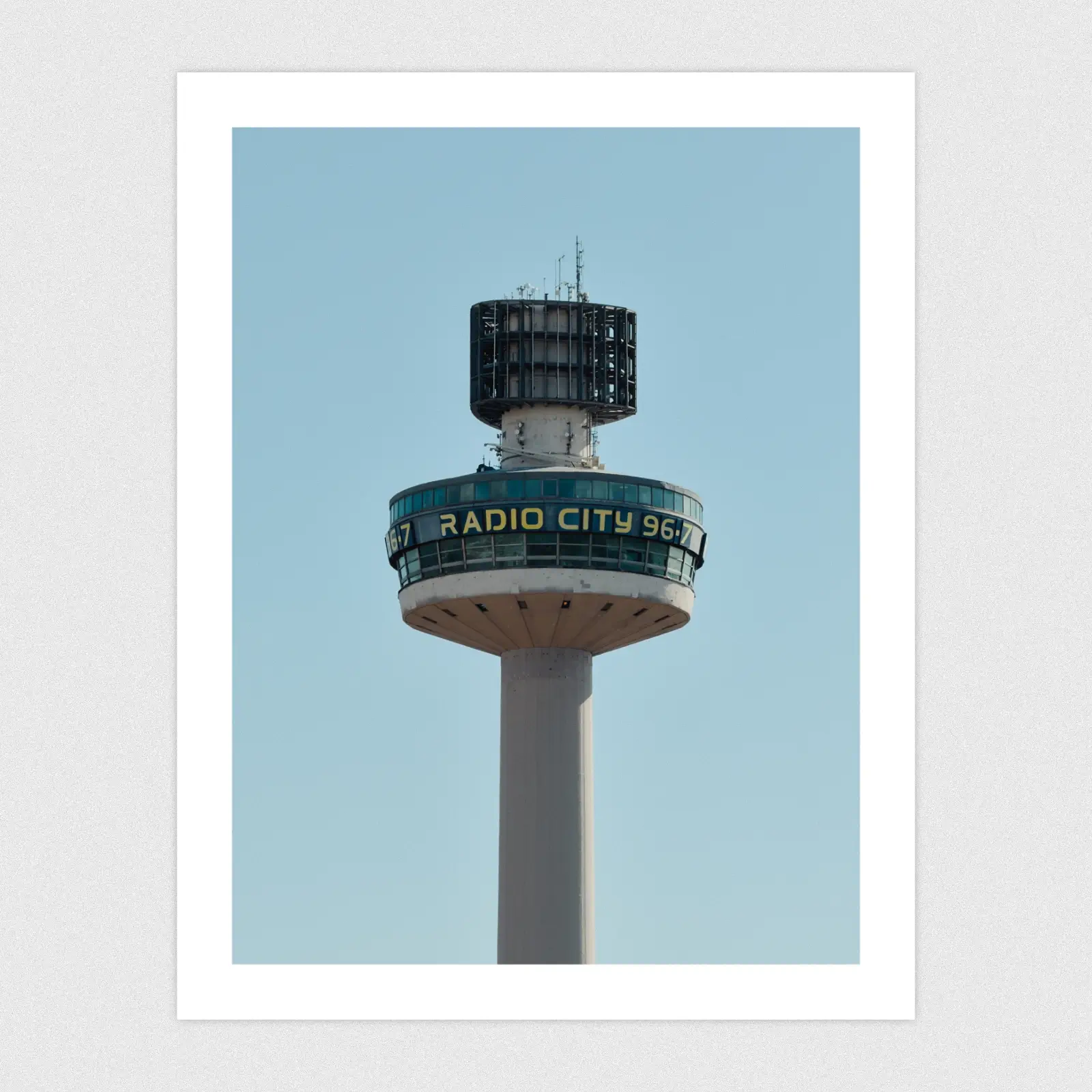 Portfolio A tall tower with a radio city building at the top.