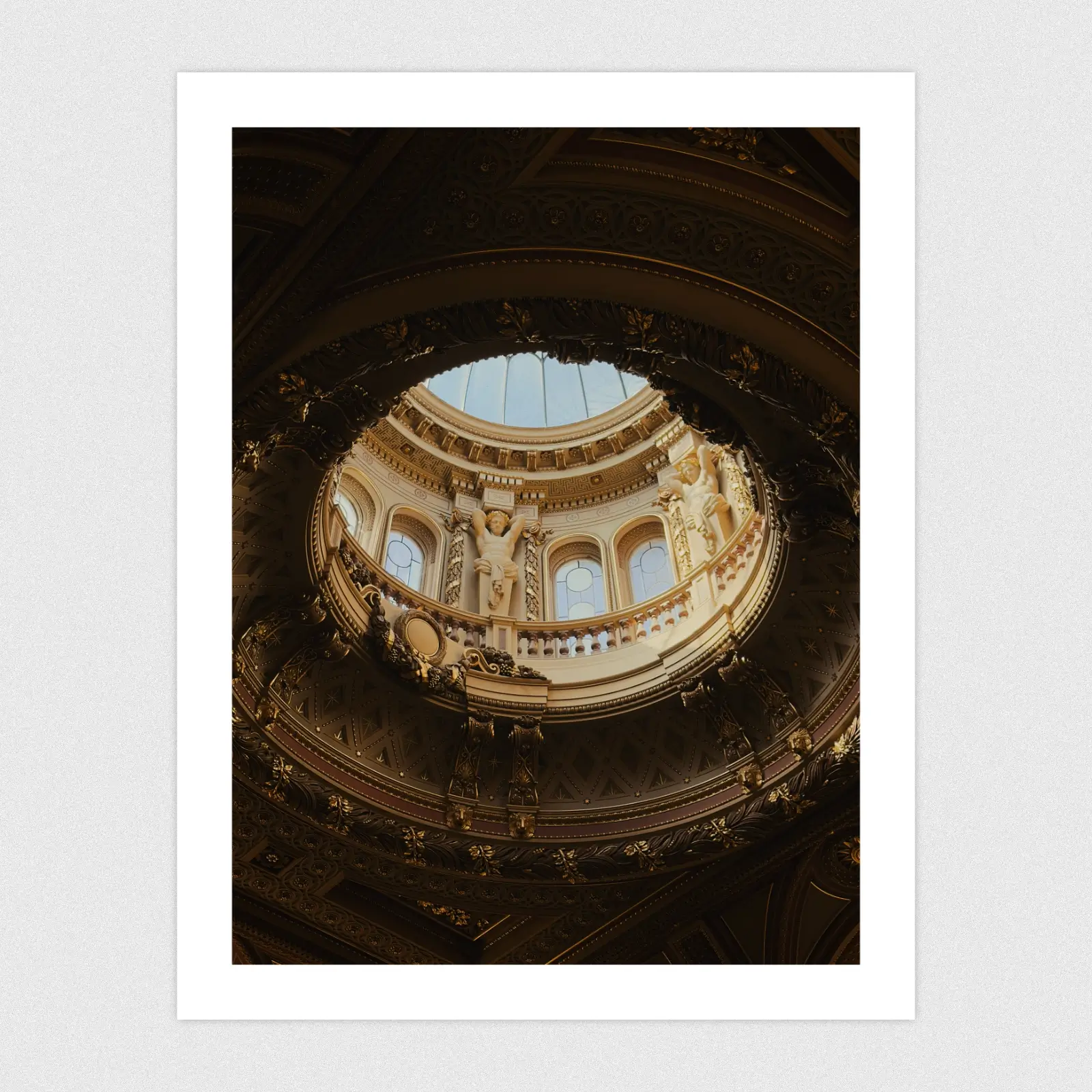 Portfolio A glass done in an ornate, golden ceiling.