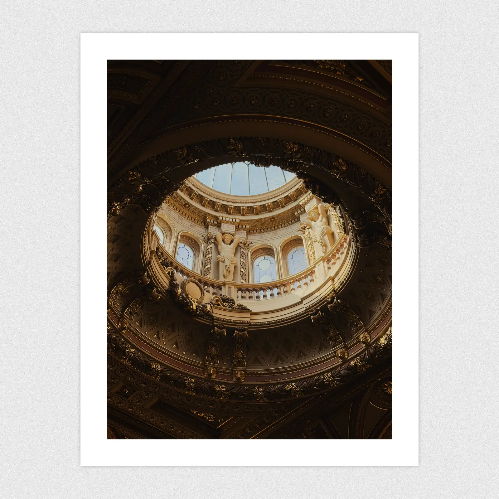 Portfolio A glass done in an ornate, golden ceiling.