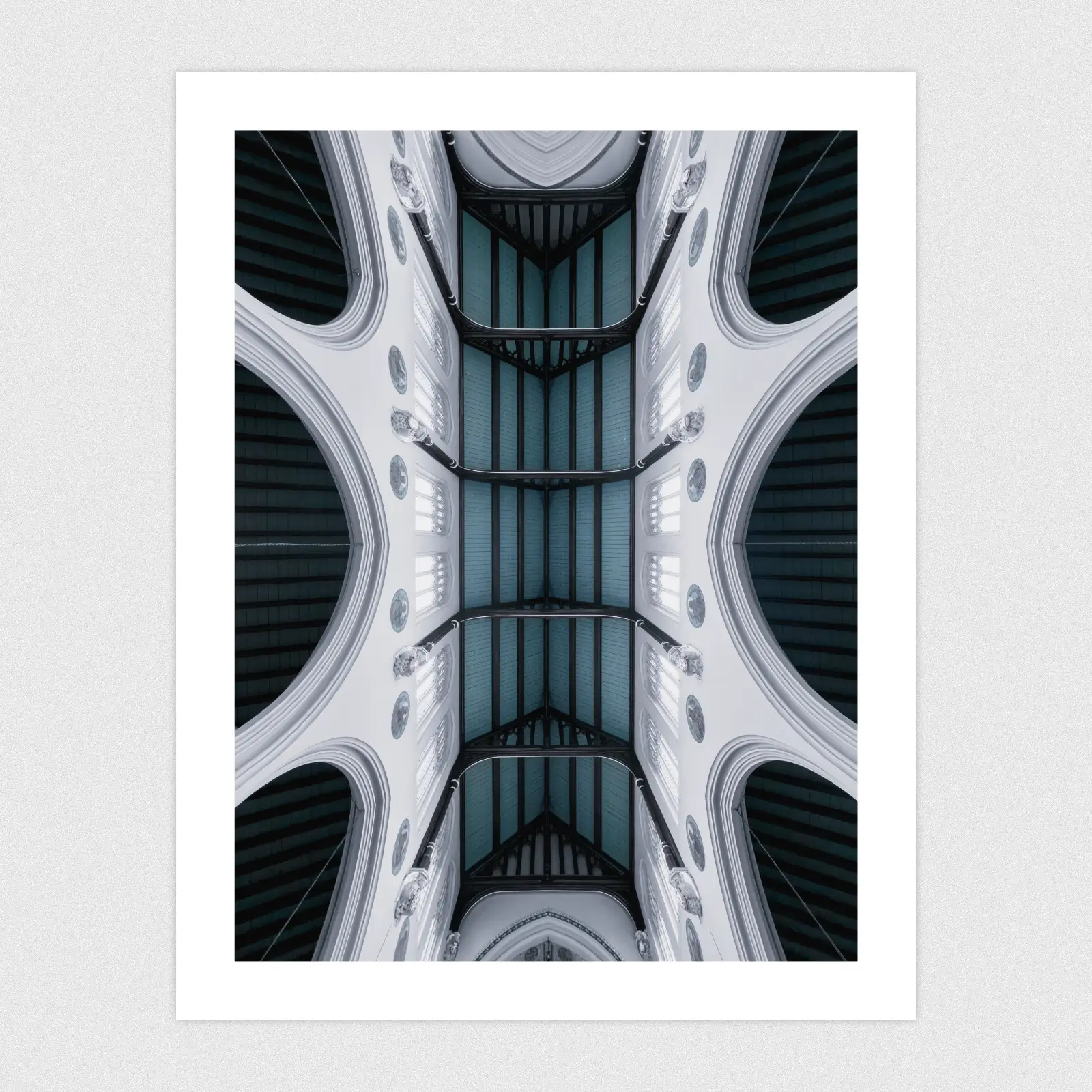 A wide angle shot looking directly up at an ornate church ceiling.