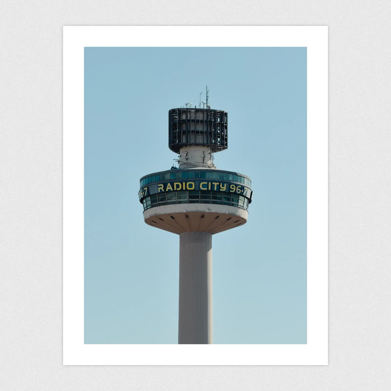 Portfolio A tall tower with a radio city building at the top.