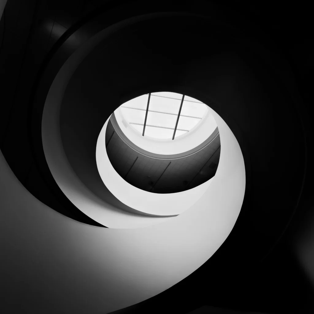 A spiral staircase inse a modern architecture building.