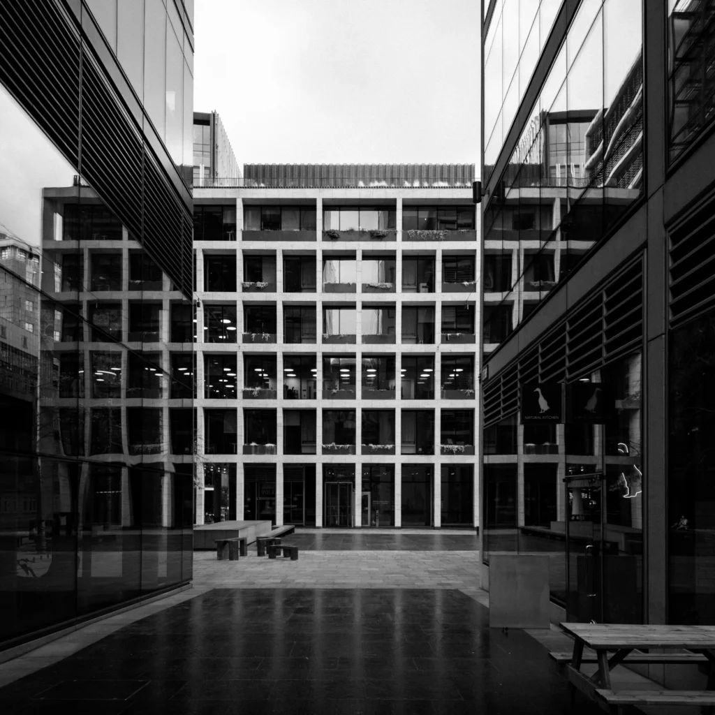 Black and white photo of a modern office block.