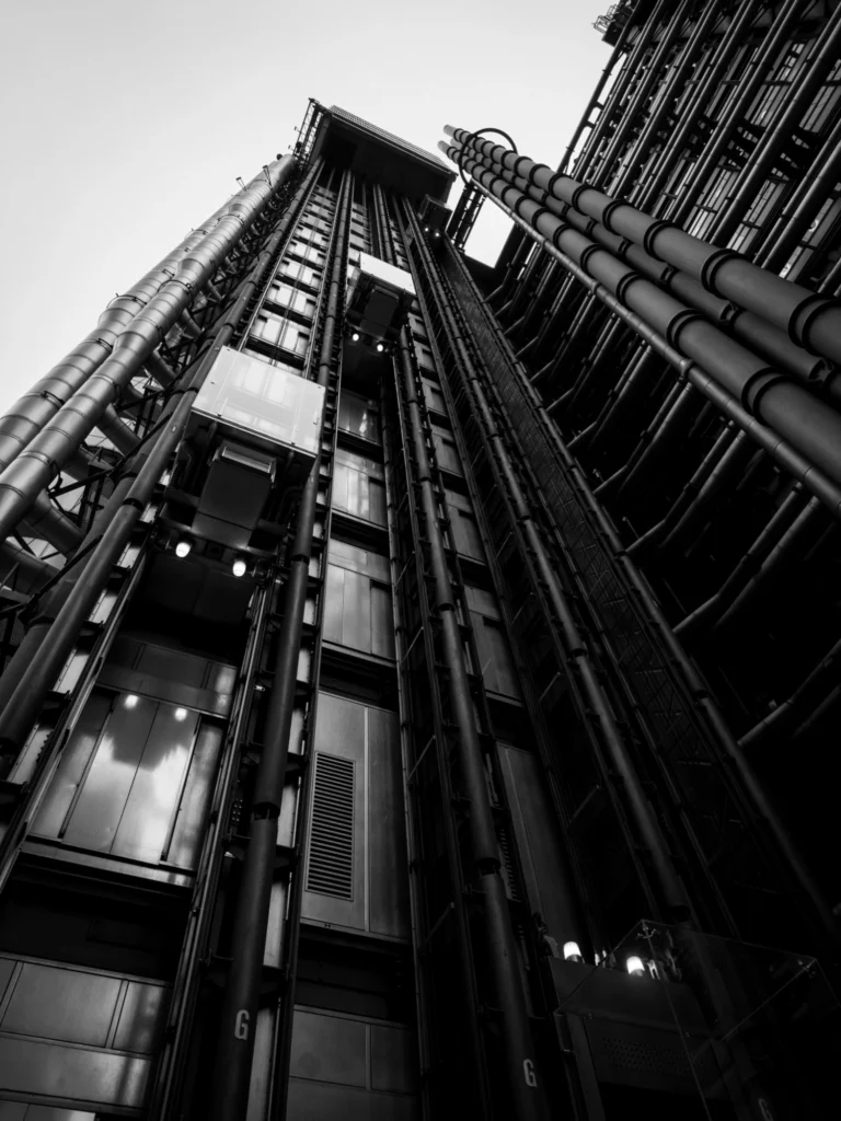 Looking up at the lifts on the exterior of the Lloyd's building in London.