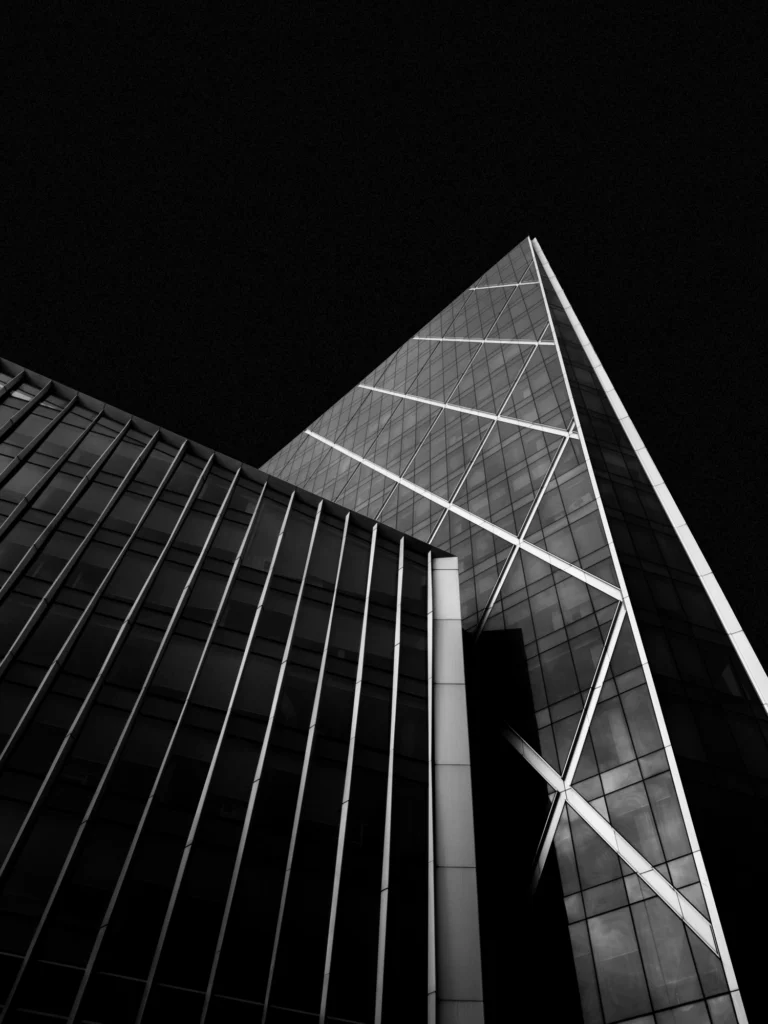 Two modern architecture buildings against a black background.