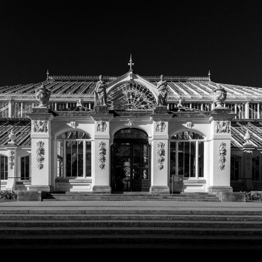 Black and white iphone photo of temperate house at kew gardens.